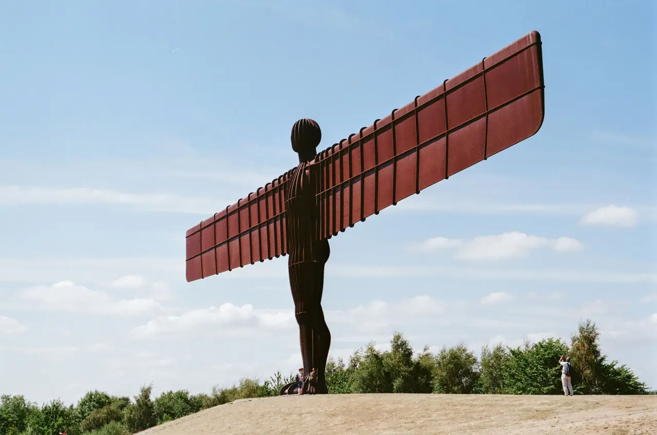 The Angel of the North sculpture at Gateshead against a blue sky